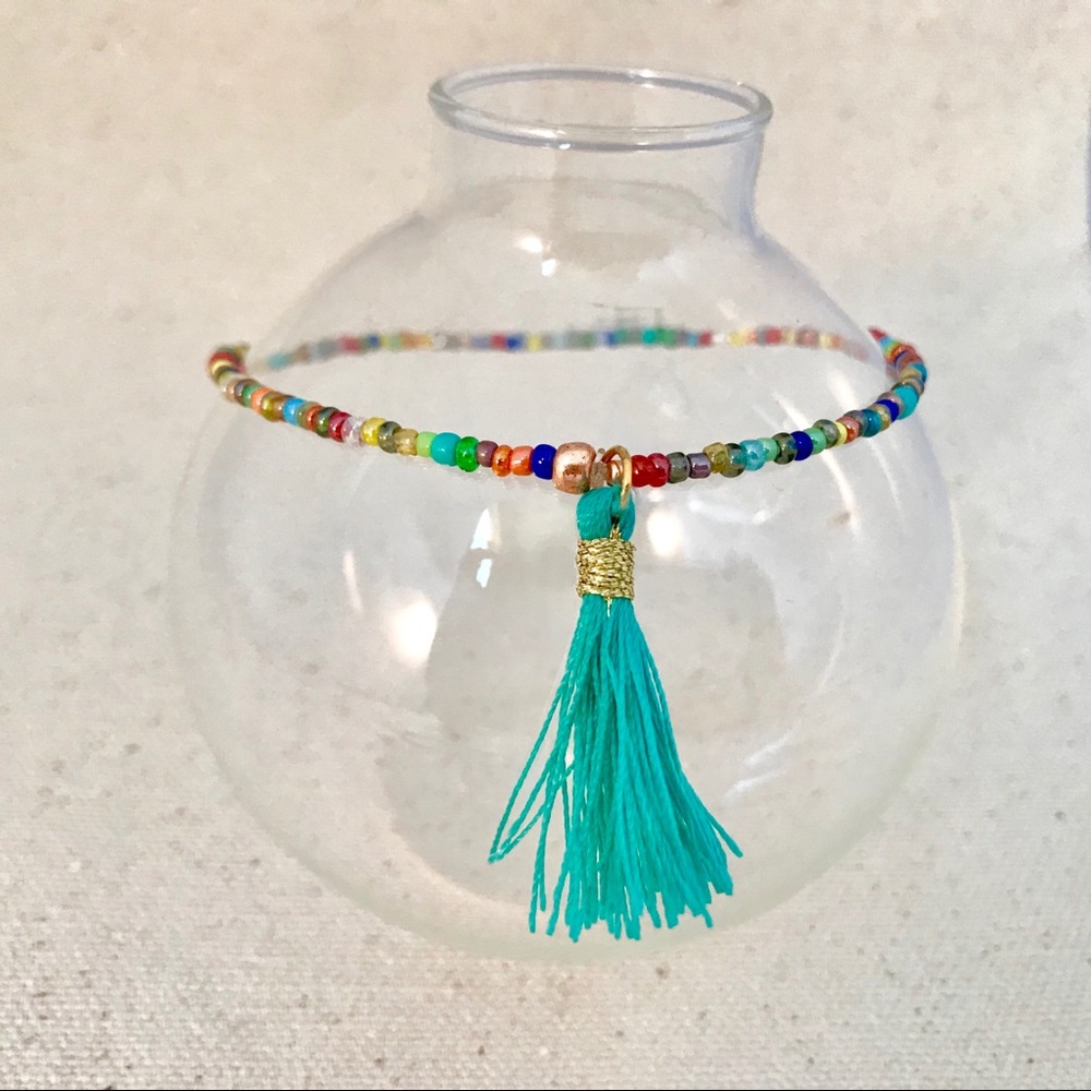 Stretch beaded anklet multicolor accent tassel